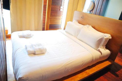 Postel nebo postele na pokoji v ubytování Srisanor Boutique Hotel