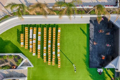 an overhead view of a building with green grass at Esperides Beach Resort in Faliraki