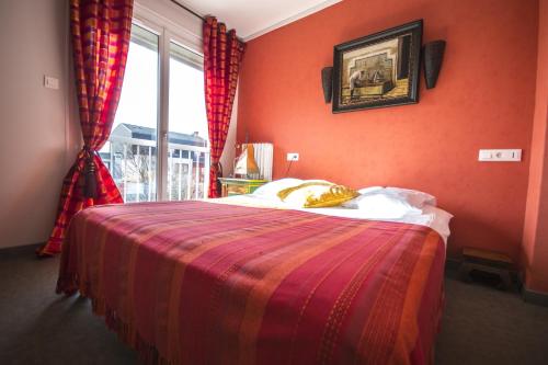Ένα ή περισσότερα κρεβάτια σε δωμάτιο στο Le Littoral