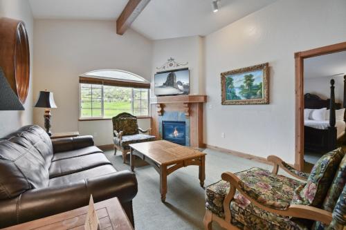 a living room with a couch and a fireplace at Adventure Hub-Ski Resorts, Backcountry & Park City 3011 villa in Midway