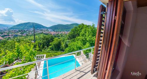 a balcony with a view of a city at Perfect view of Mostar - with swimming pool in Mostar