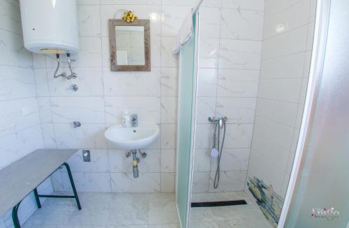 a bathroom with a sink and a shower at Perfect view of Mostar - with swimming pool in Mostar