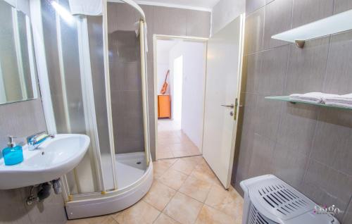 a bathroom with a shower and a sink and a toilet at Perfect view of Mostar - with swimming pool in Mostar