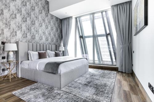 Un ou plusieurs lits dans un hébergement de l'établissement SIMPLY COMFORT in J ONE Tower
