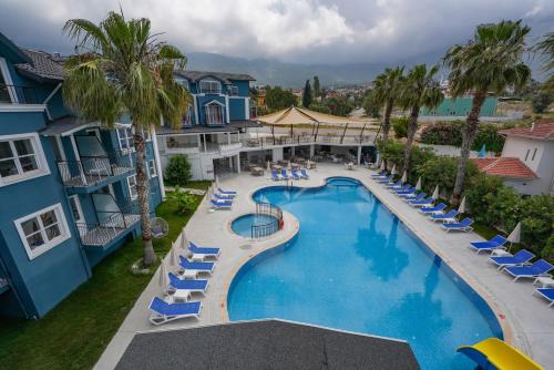 an aerial view of a pool at a resort at Blue Pearl Hotel in Ovacik