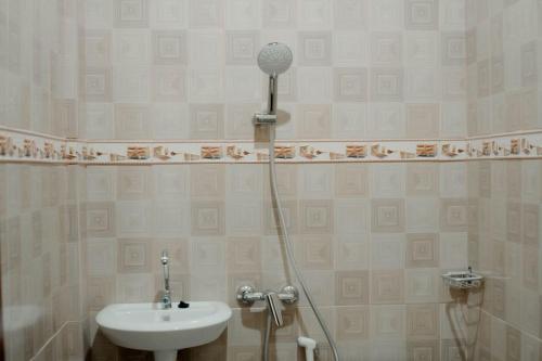 a bathroom with a sink and a shower at Cahaya Green Bali in Pesanggaran