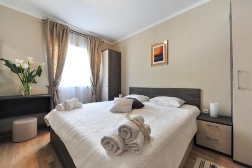 מיטה או מיטות בחדר ב-Apartmani Perić 1 Meka Draga