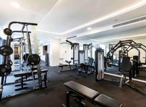 a gym with several treadmills and machines at Welcome to Skyview - top level in Glen Waverley