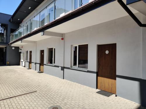 a row of doors on the side of a building at Noclegi M4 in Żyrardów