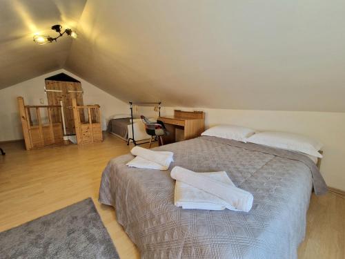 a bedroom with a bed with towels on it at Promenada Apartment in Srima