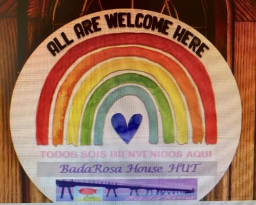 a sign that reads all are welcome here with a rainbow at BADAROSA House10min to BARCELONA City&NearTo BEACH in Badalona