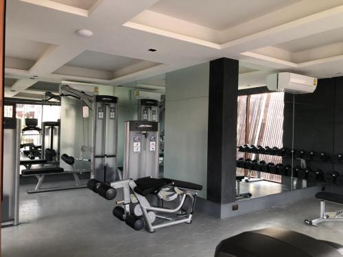 a gym with several treadmills and a treadmill at Rarin Villas in Chiang Mai