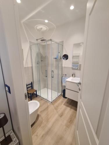 a bathroom with a shower and a toilet and a sink at Ginger by PortofinoVacanze in Rapallo
