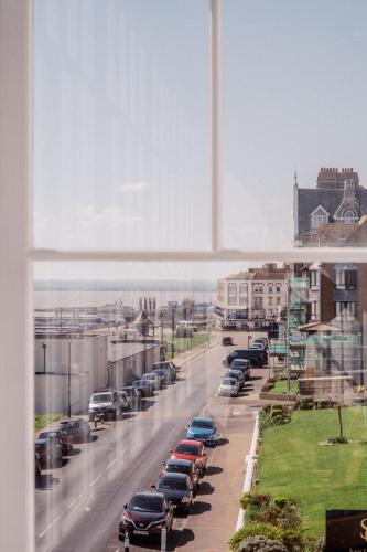 a view of a city street with cars parked at San Clu Hotel, Bar & Brasserie in Ramsgate