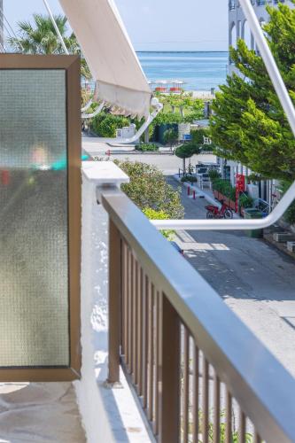 a balcony with a view of the beach at Brunis Apartments in Nei Poroi