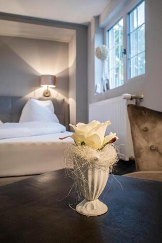 Ένα ή περισσότερα κρεβάτια σε δωμάτιο στο Landcafe mit Mini Hotel