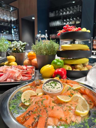 a buffet of seafood and vegetables on a table at Hotel Weißes Ross in Kulmbach