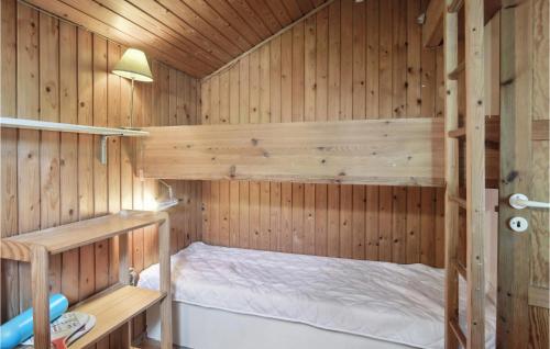 a wooden cabin with a bed in the middle at Awesome Home In Eskebjerg With Wifi in Eskebjerg