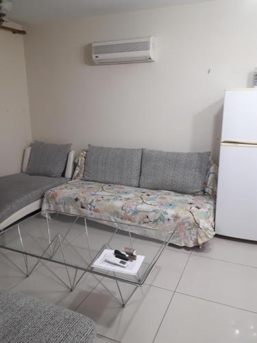 a living room with a couch and a table at Nicosia City Centre Apartment in Nicosia