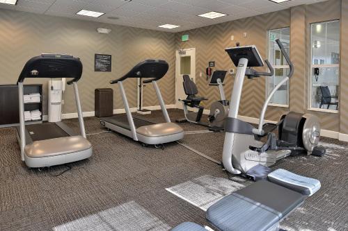 a gym with treadmills and cardio equipment in a room at Residence Inn by Marriott Denver Airport at Gateway Park in Aurora