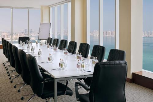 a conference room with a long table and chairs at Delta Hotels by Marriott City Center Doha in Doha
