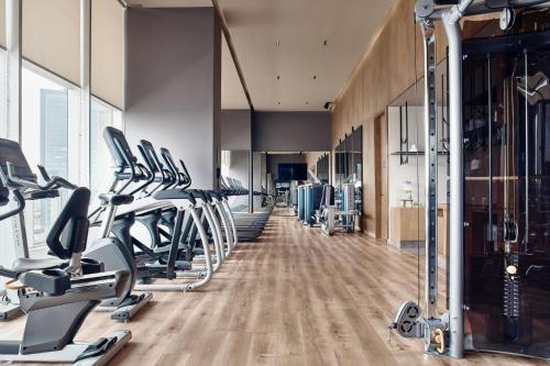 a gym with treadmills and elliptical machines at JW Marriott Hotel Guadalajara in Guadalajara