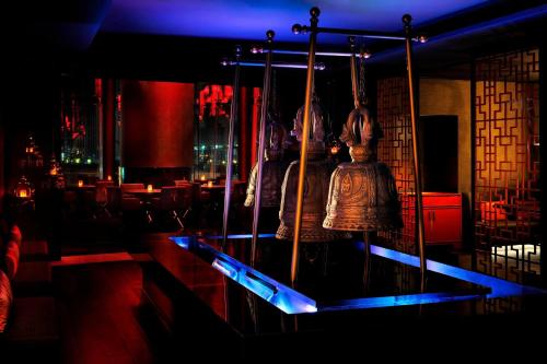 a room with a bell hanging on a swing at JW Marriott Marquis Hotel Dubai in Dubai