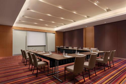 a large conference room with a long table and chairs at Marriott Executive Apartments Sukhumvit Park, Bangkok in Bangkok