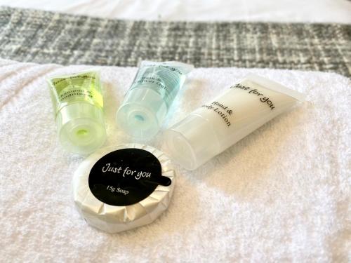 two bottles of moisturizers sitting on a towel at 8 Margaret Road, Whitley Bay in Whitley Bay