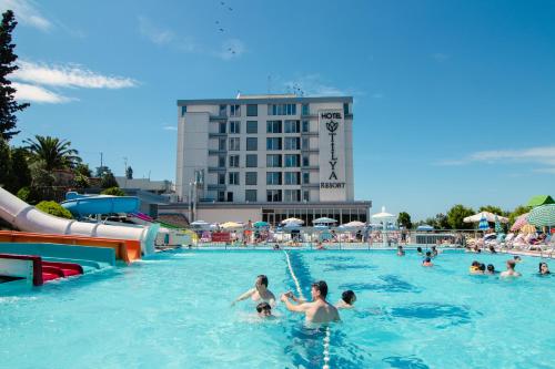 a group of people playing in a swimming pool at Tilya Resort Hotel in Trabzon
