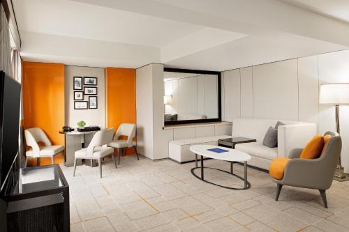 a living room with a couch and a table at Sheraton Universal in Los Angeles