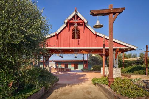 a red barn with a street light in front of it at Sheraton Fairplex Suites & Conference Center in Pomona