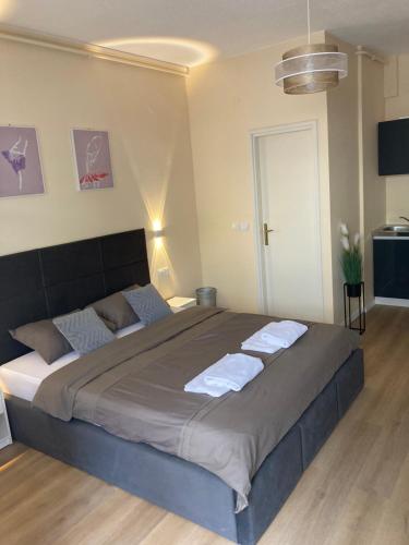 a bedroom with a large bed with towels on it at STUDIOAPARTMANI JEDVAJ in Krapina