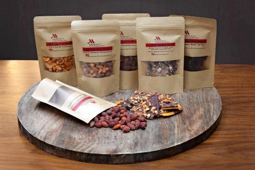 a table with a bunch of bags of nuts and seeds at Pleasanton Marriott in Pleasanton