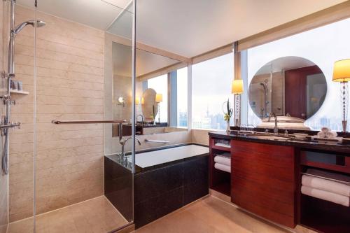 a bathroom with a shower and a sink at JW Marriott Shanghai at Tomorrow Square in Shanghai