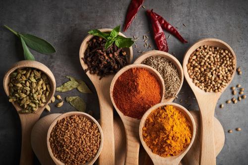 a group of spoons filled with different spices at The Westin Bund Center, Shanghai in Shanghai