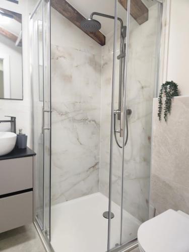 a shower with a glass door in a bathroom at Rio Luxury Rooms in Split