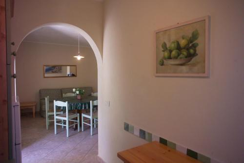 a room with a painting of a bowl of fruit on the wall at Appartamenti Tallinucci in Lacona