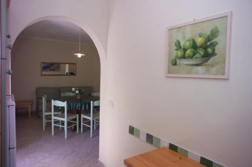 a room with a picture of a bowl of fruit on the wall at Appartamenti Tallinucci in Lacona
