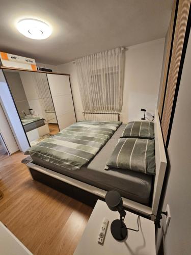 Postel nebo postele na pokoji v ubytování Apartman Cresnar