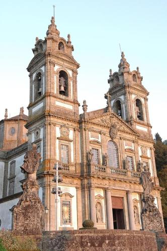 an old building with a clock tower on top of it at Hotel do Lago in Braga