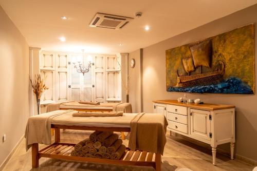 a room with two beds and a painting on the wall at Mark Warner Phokaia Beach Resort in Foca