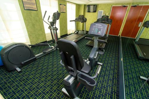 a gym with treadmills and ellipticals in a room at Wyndham Garden Monterrey Aeropuerto in Monterrey
