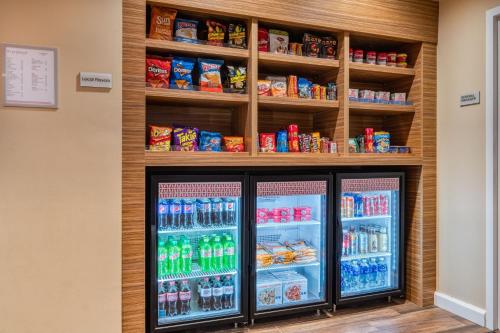 a refrigerator filled with lots of drinks at TownePlace Suites by Marriott Indianapolis Airport in Indianapolis