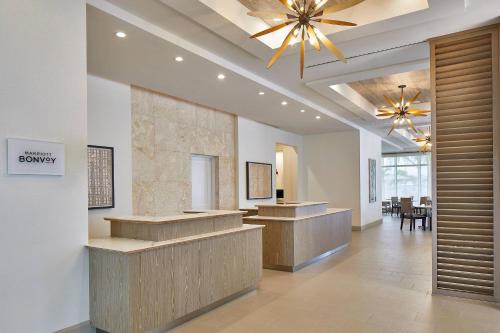 a lobby with a hair salon with a ceiling fan at Residence Inn St. Petersburg Tierra Verde in Tierra Verde