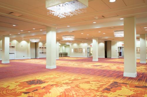 a large ballroom with columns and a large hall at Louisville Marriott East in Louisville