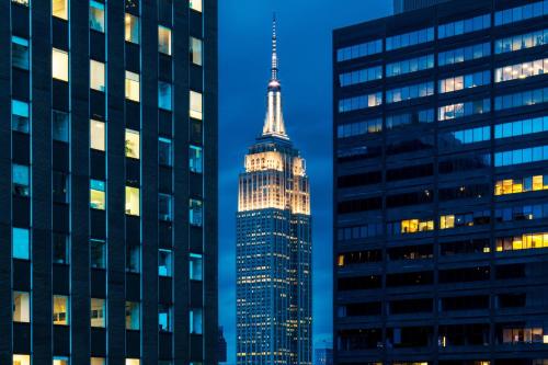 an image of the empire state building at night at The Westin New York Grand Central in New York