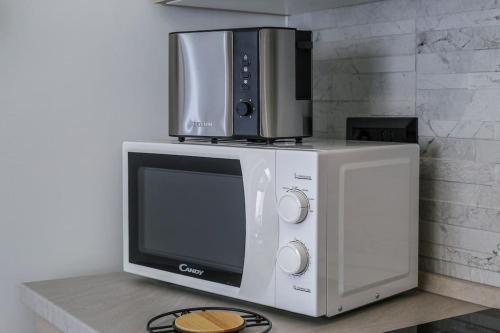 Η κουζίνα ή μικρή κουζίνα στο SWEET HOME, Wi-fi, Netflix, Disney Plus, Prime video