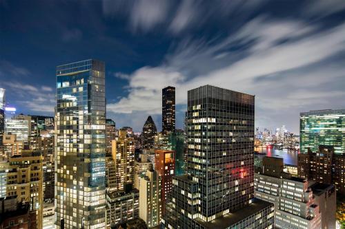 a view of a city skyline at night at The Westin New York Grand Central in New York
