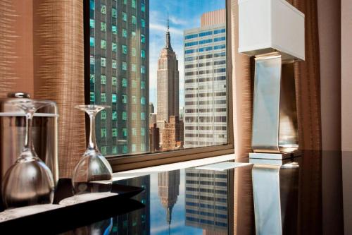 a window with a view of a city skyline at The Westin New York Grand Central in New York